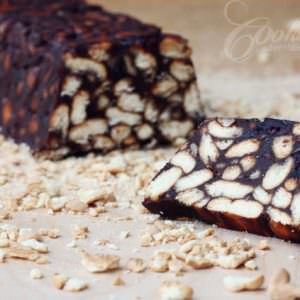 Chocolate Biscuit Cake with Cranberries and Nuts cut into slices