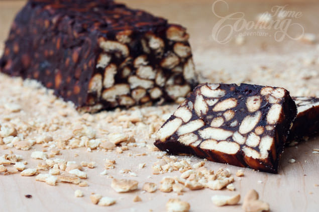 Chocolate Biscuit Cake with Cranberries and Nuts cut into slices