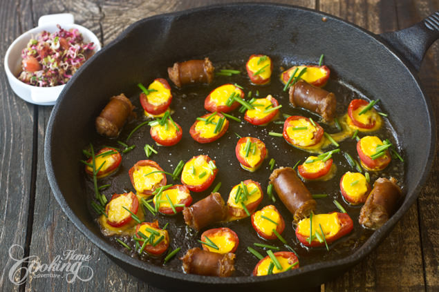 Grape tomatoes with egg on top