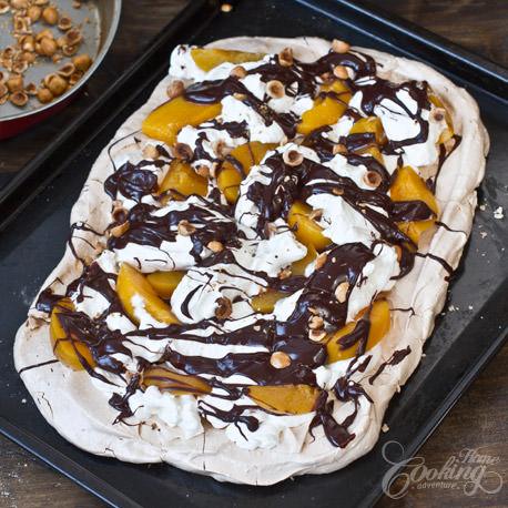 peach chocolate pavlova with hazelnuts