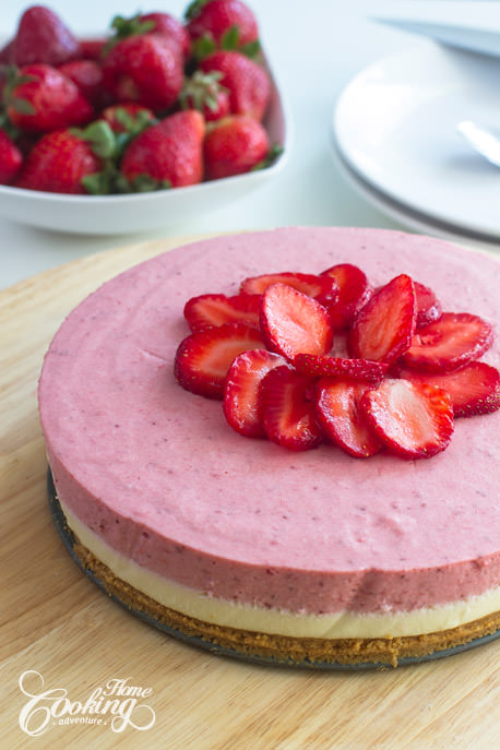 No-Bake White Chocolate Strawberry Mousse Cake topped with fresh strawberries