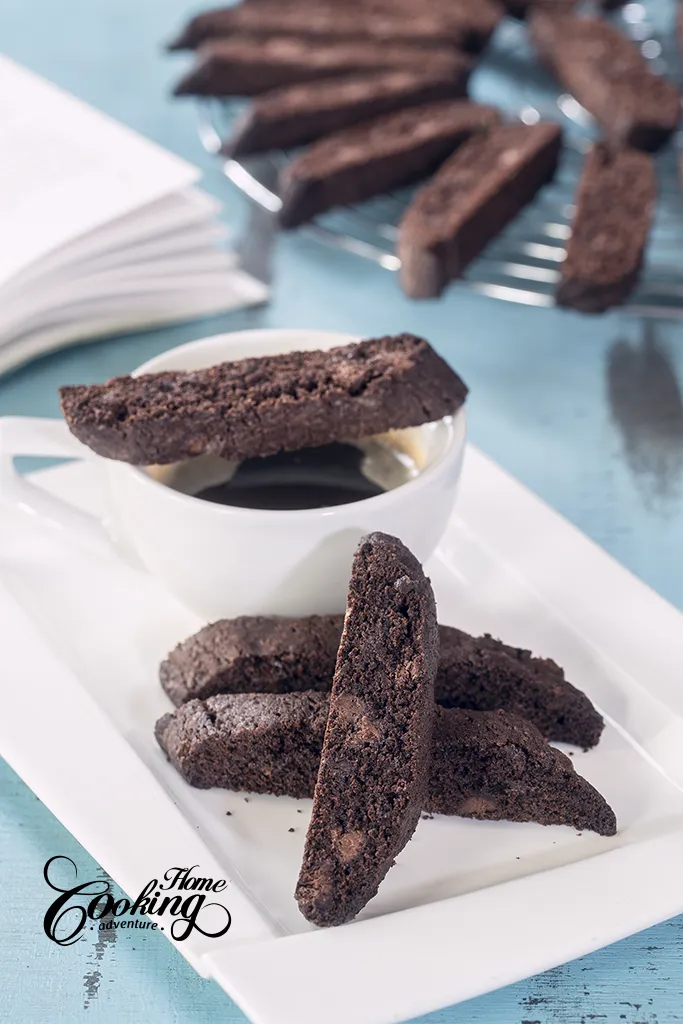 double chocolate biscotti alongside a cup of coffee