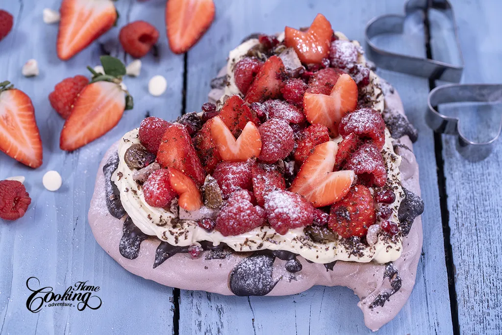 Heart Shaped chocolate pavlova wih cream cheese frosting and fresh berries