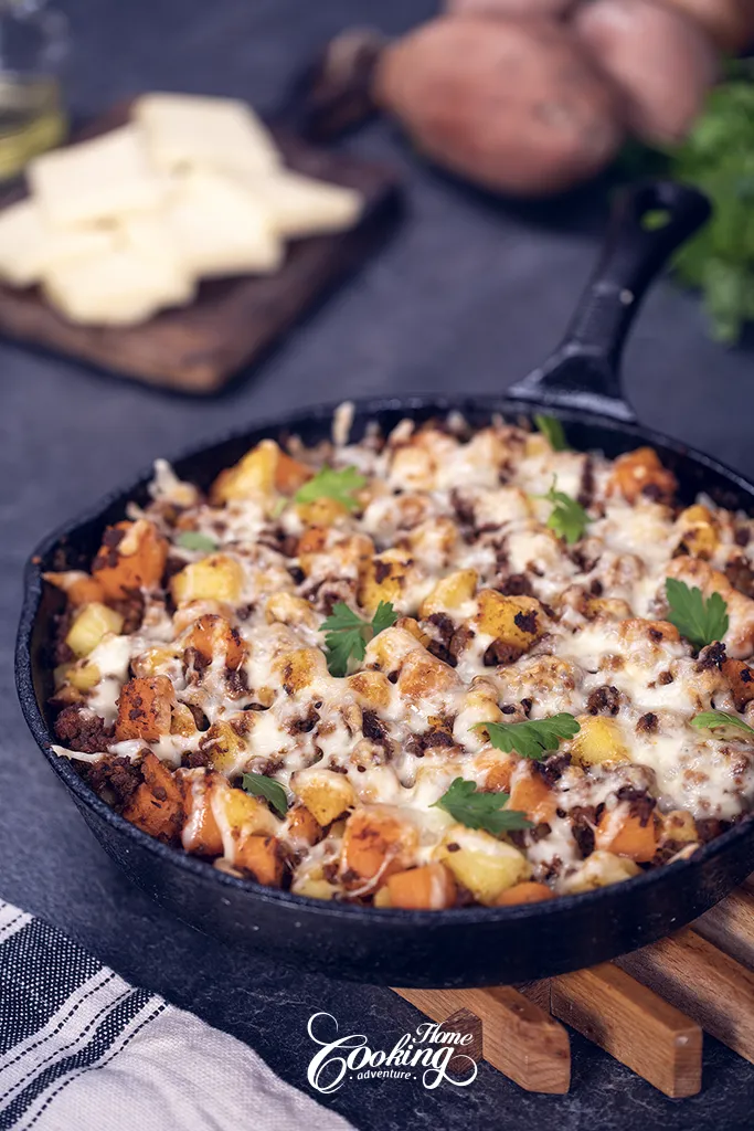 meat and potato skillet with cheese on top