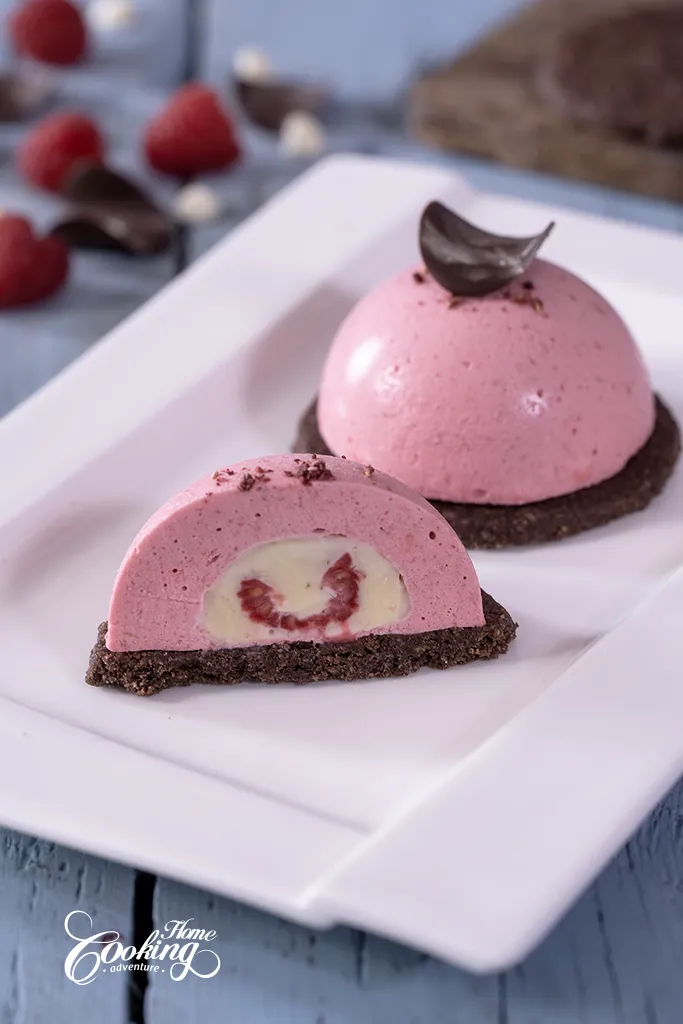 Chocolate Raspberry Mousse Domes with white chocolate and raspberry insert