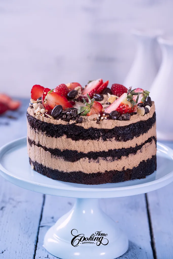 chocolate strawberry coffee layer cake topped with fresh strawberries