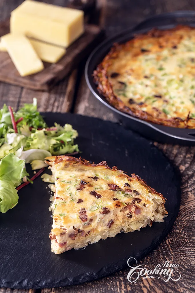 Quiche slices with potato crust and fresh salad