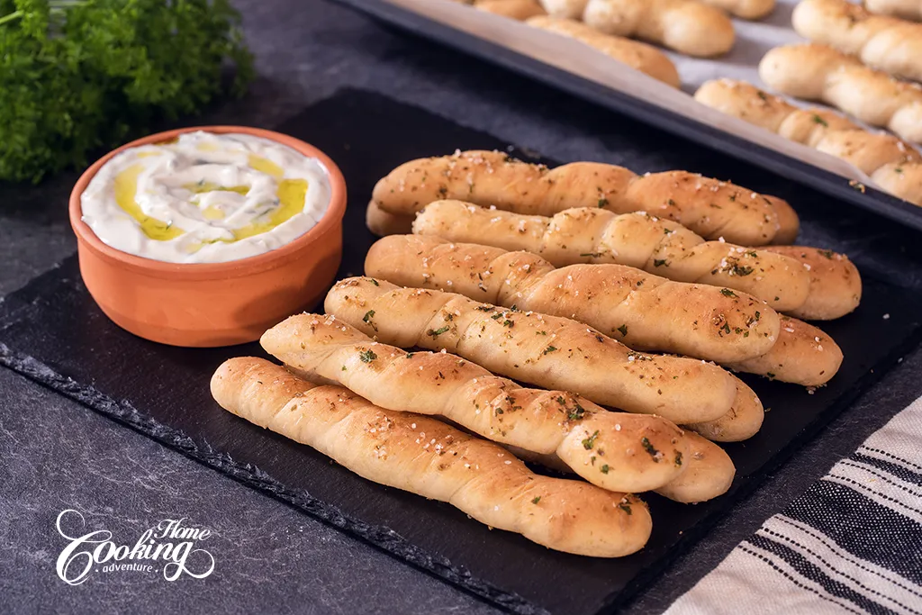 homemade breadsticks with olive oil, garlic and herbs