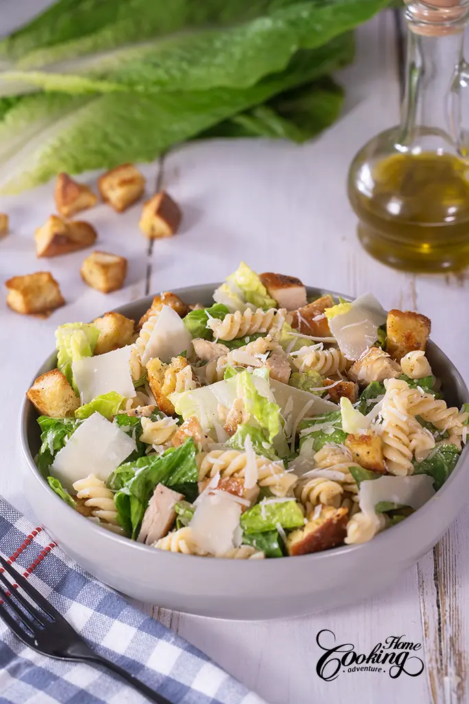 Chicken Caesar Pasta Salad with Parmesan shavings on top