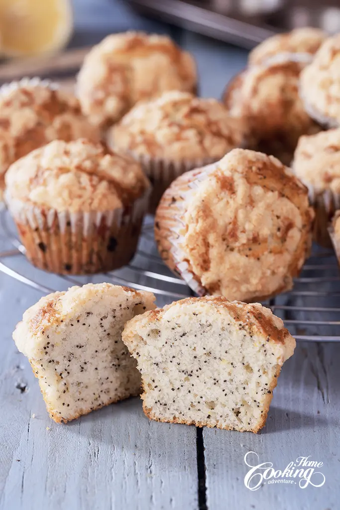 Lemon Poppy Seed Crumble Muffins with a beautiful section of a muffin