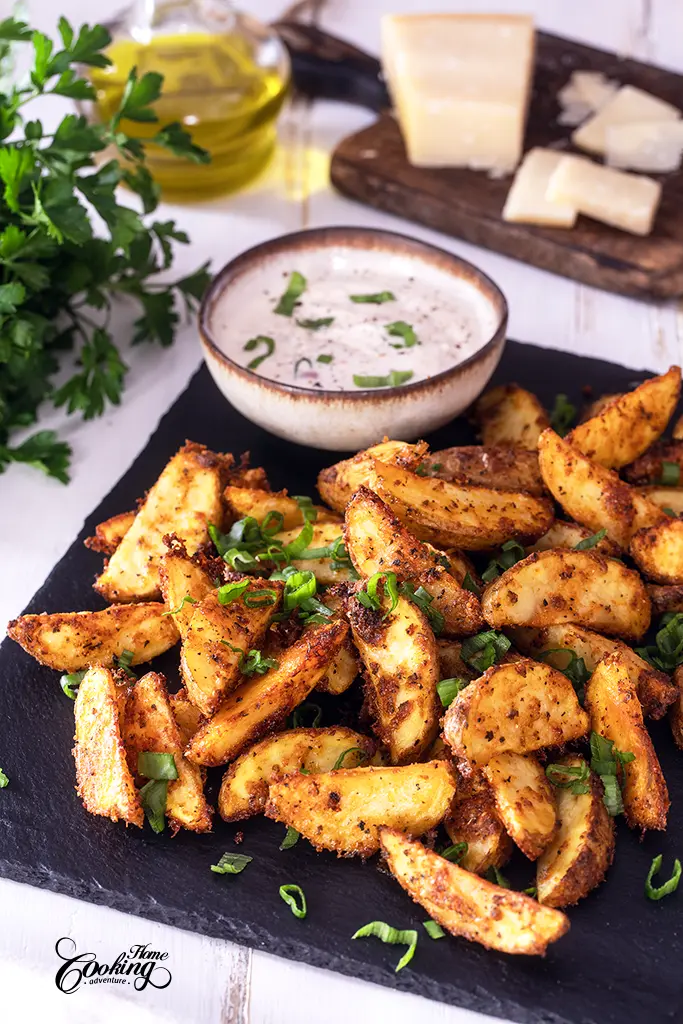 Perfect Roasted Potatoes on a platter with a Greek yogurt dipping sauce