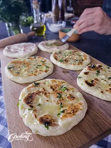brush the flatbreads with butter parsley mixture