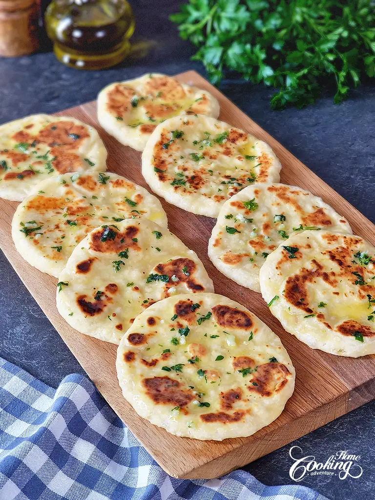 Yogurt Flatbreads with cheese brushed with butter parsley mixture