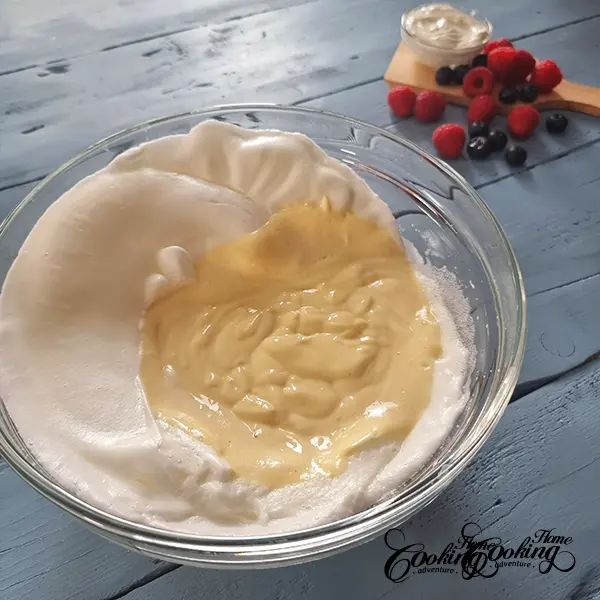 folding the whites into the yolk mixture for yogurt cake