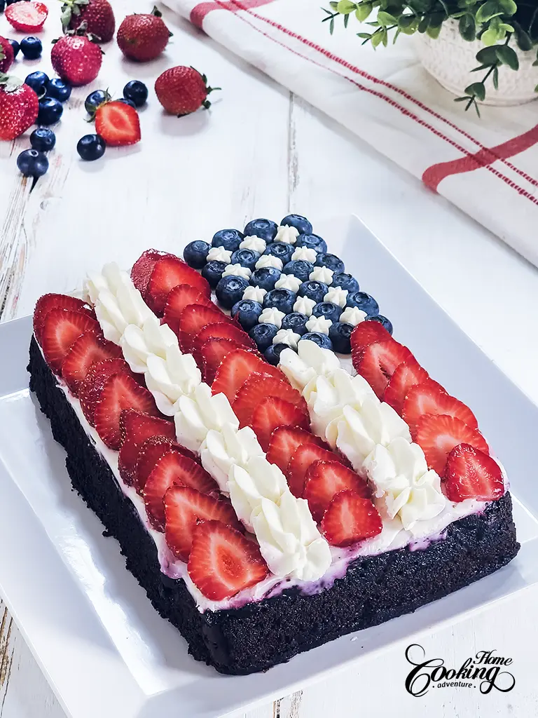 American Flag Cake - moist chocolate cake soaked in chocolate liqueur syrup and decorated with berries and cream cheese frosting