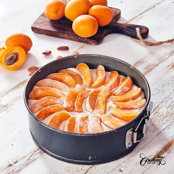 arrange apricot slices on top of the cake batter