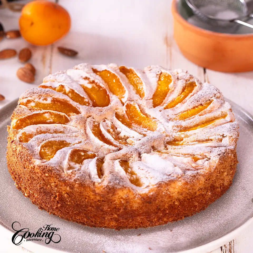 apricot almond cake dusted with powdered sugar