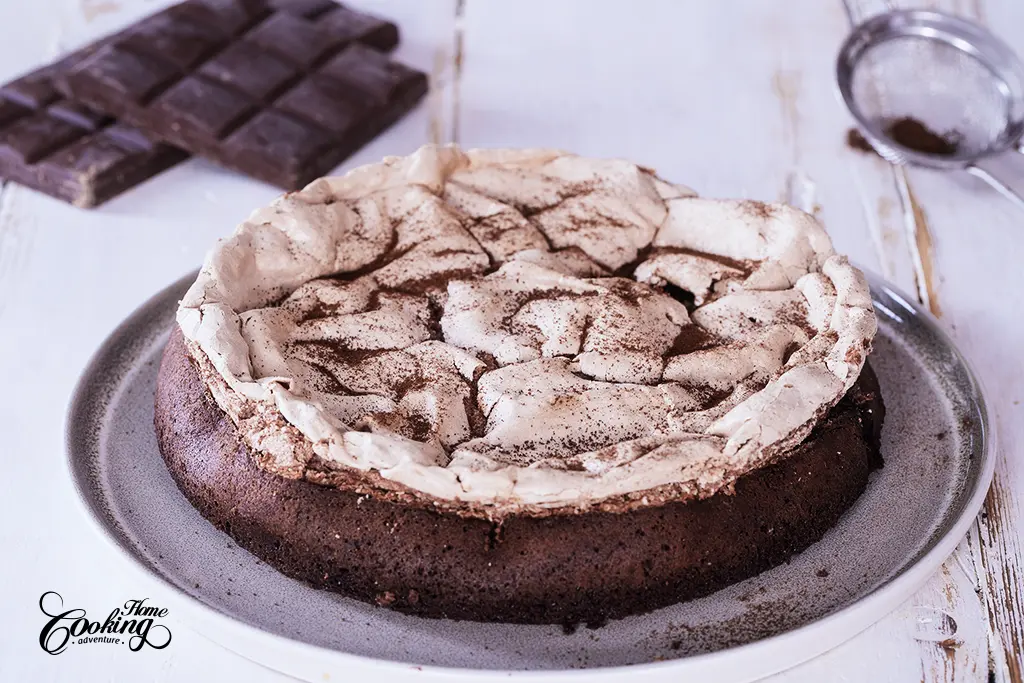 flourless chocolate raspberry meringue cake with instant coffee dusting. 