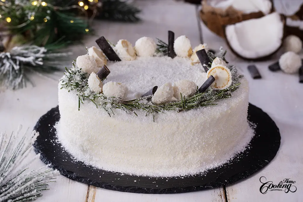 Chocolate Coconut Christmas Cake  - decorated with rosemary, coconut truffles and chocolate sticks