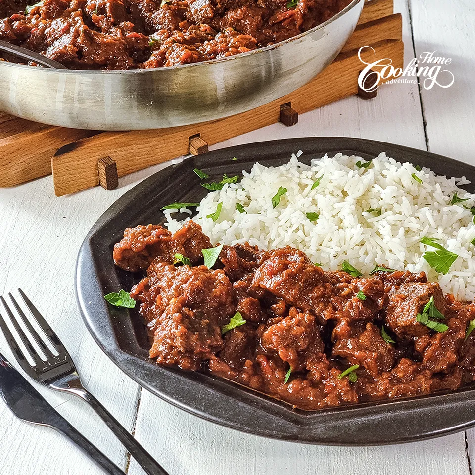 Beef Stew with Caramelize Onions alongside rice 