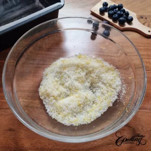 blueberry lemon pound cake - mixing lemon zest and sugar until oil is released