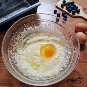 Add eggs to the batter - blueberry lemon pound cake.